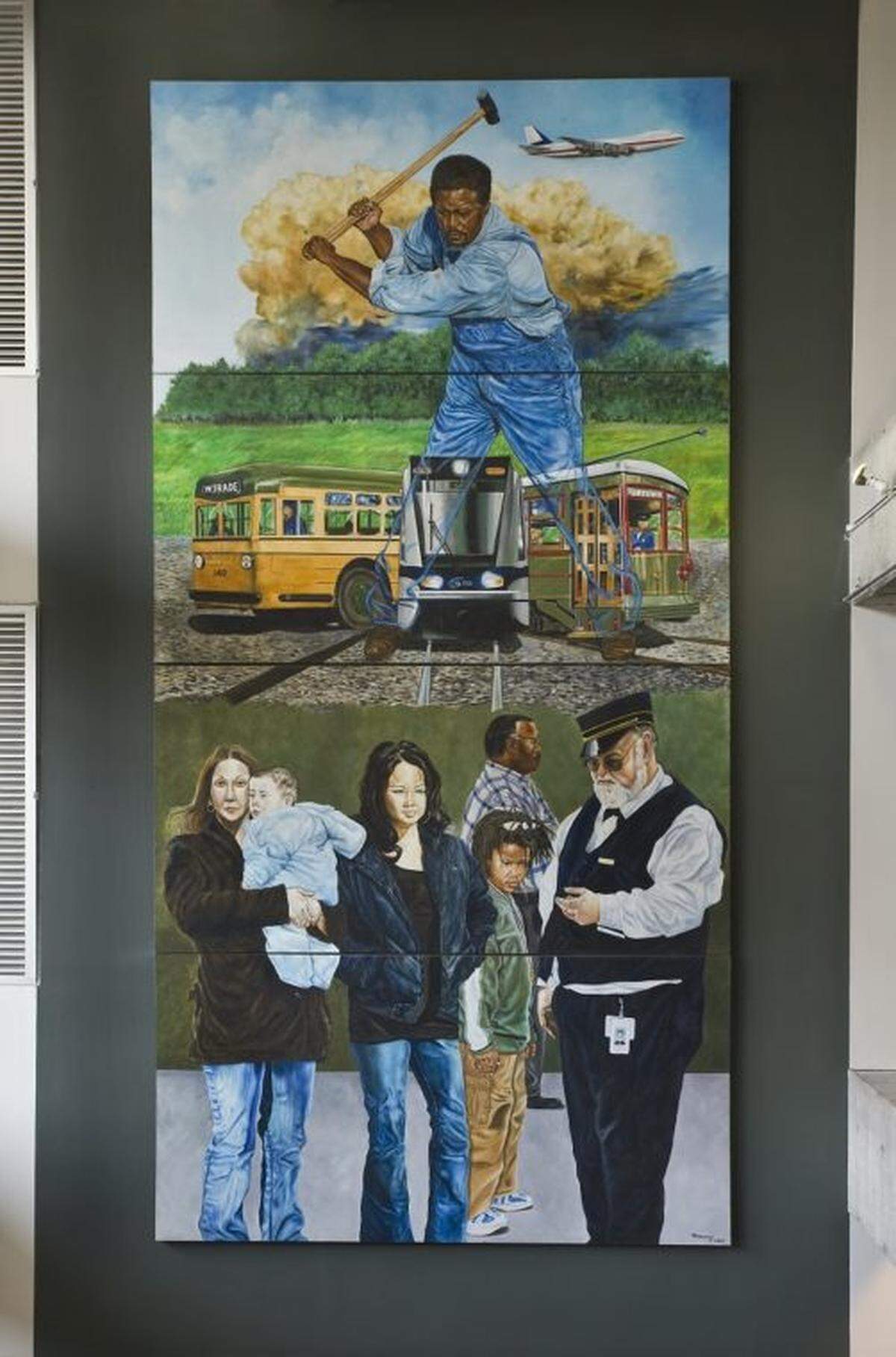 Tommie Robinson’s “Transportation” mural is inside the Spectrum Center in uptown Charlotte. A companion mural titled “Banking and Commerce,” is nearby. They can be found near the escalator area.