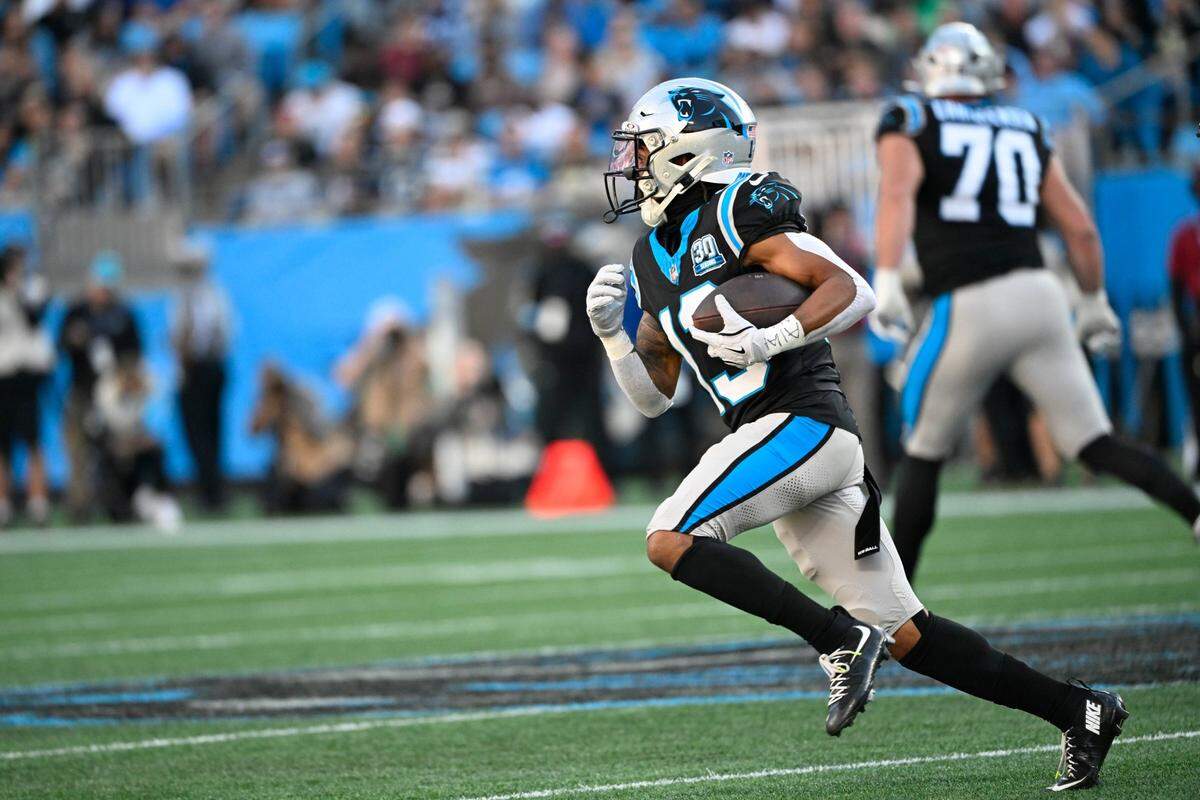 Nov 3, 2024; Charlotte, North Carolina, USA; Carolina Panthers wide reciever Deven Thompkins (13) with the ball in the fourth qarter at Bank of America Stadium. Mandatory Credit: Bob Donnan-Imagn Images