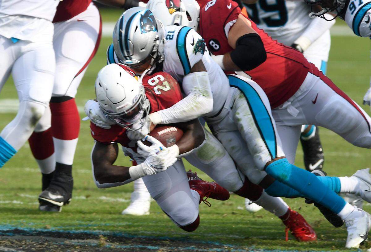 Carolina Panthers rpokie safety Jeremy Chinn (21) makes a tackle against Arizona. Chinn leads the Panthers in tackles through four games with 34.