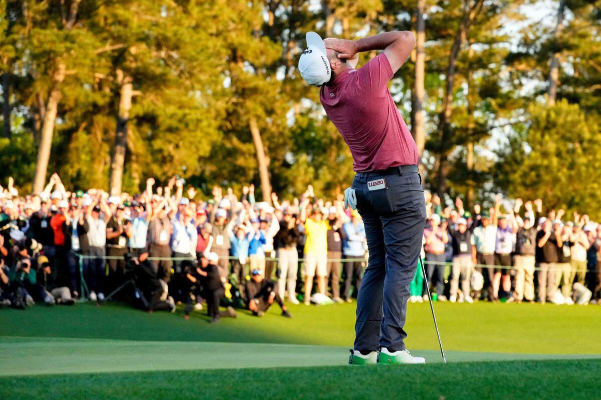 Jon Rahm reacts on the 18th green after winning the Masters.