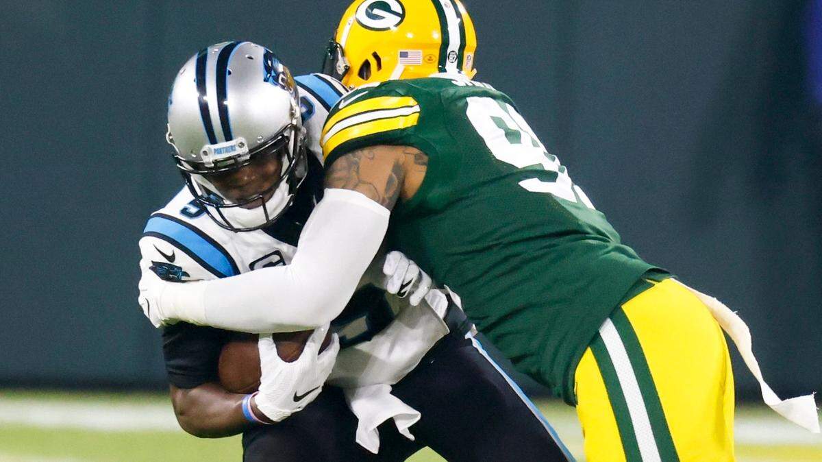 Green Bay Packers’ Preston Smith sacks Carolina Panthers’ Teddy Bridgewater during the first half of an NFL football game Saturday, Dec. 19, 2020, in Green Bay, Wis. (AP Photo/Matt Ludtke)