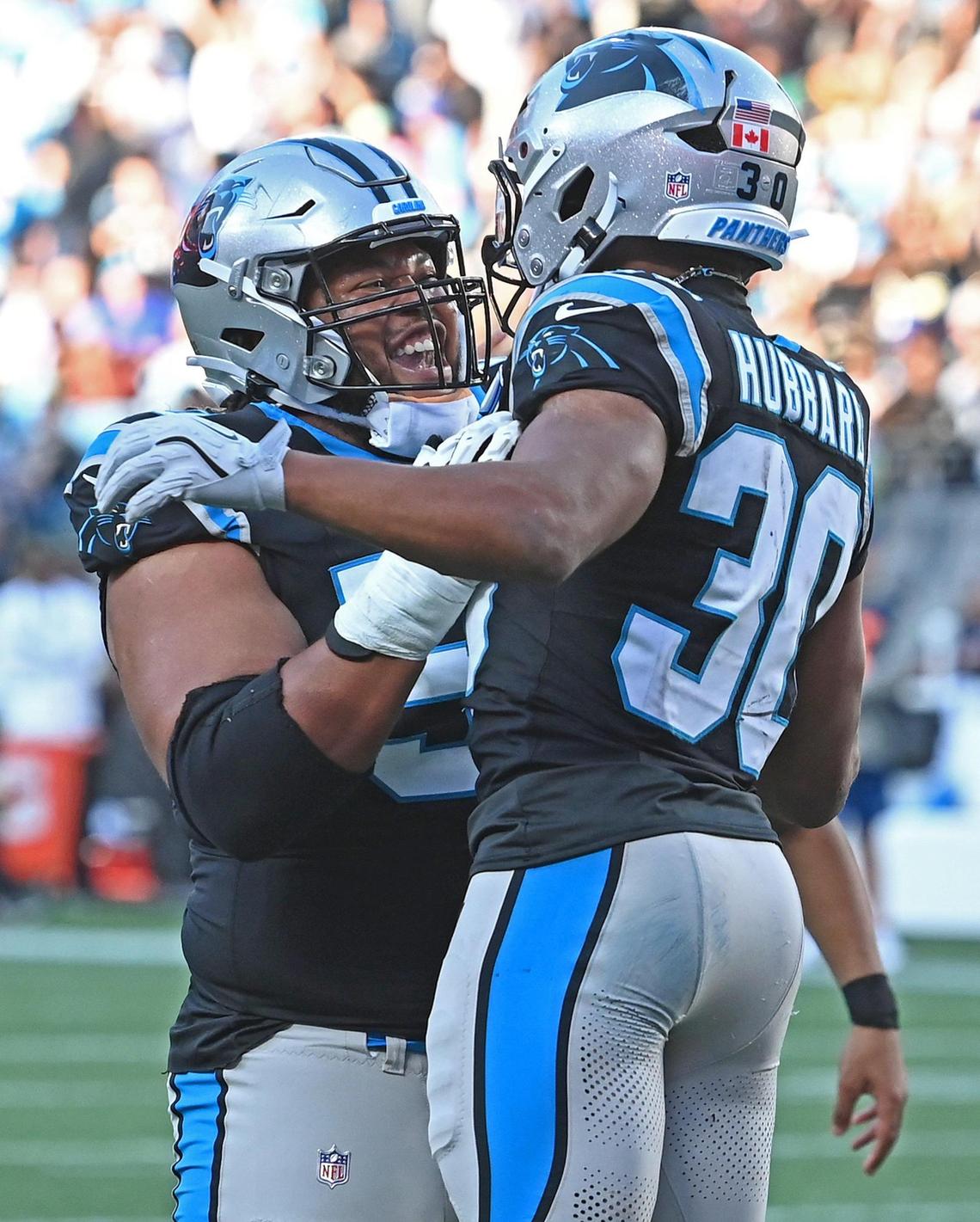 Carolina Panthers guard Robert Hunt, left, lifts running back Chuba Hubbard, right, into the air after Hubbard rushed for a touchdown during fourth quarter action against the New Orleans Saints at Bank of America Stadium in Charlotte, NC on Sunday, November 3, 2024. The Panthers defeated the Saints 23-22.