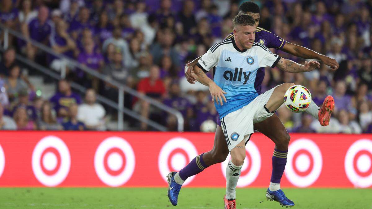 Nov 9, 2024; Orlando, Florida, USA; Charlotte FC midfielder Pep Biel (10) plays the ball against Orlando City during the second half in a 2024 MLS Cup Playoffs Round One match at Inter&Co Stadium.