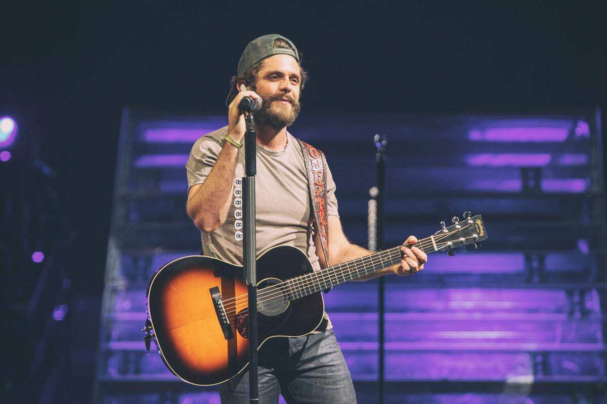 Thomas Rhett brought fans to their feet during an ‘Unforgettable’ night on Friday during the Charlotte leg of his ‘Very Hot Summer’ tour at PNC Music Pavilion.