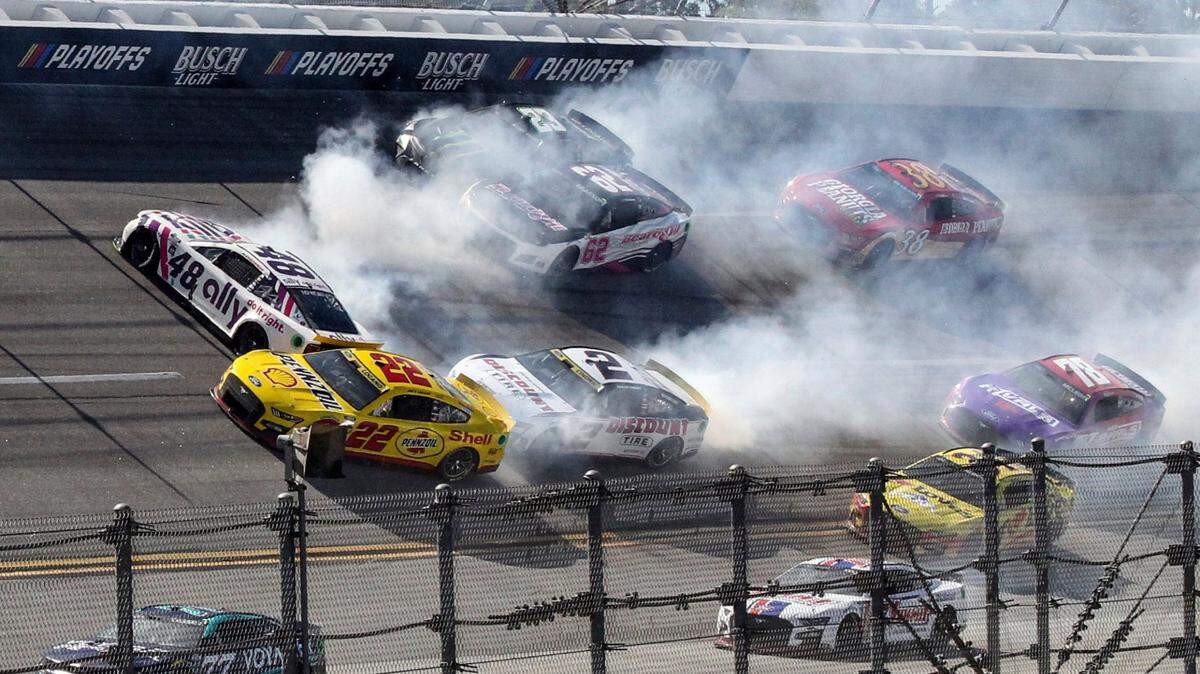 Alex Bowman (48), Joey Logano (22), Austin Cindric (2), Justin Allgaier (62) and Ty Gibbs (23) are involved in a crash in Turn 1 during a NASCAR Cup Series auto race Sunday, Oct. 2, 2022, in Talladega, Ala. (AP Photo/Skip Williams)