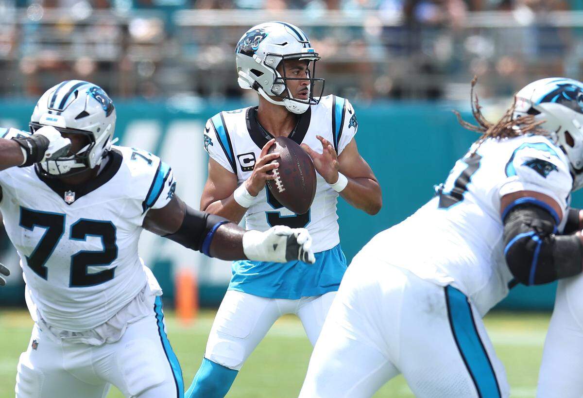 Carolina Panthers quarterback Bryce Young, center, stands in the pocket looking to pass during action against the Jacksonville Jaguars on Sunday, September 7, 2025 at Everbank Stadium in Jacksonville, Florida.