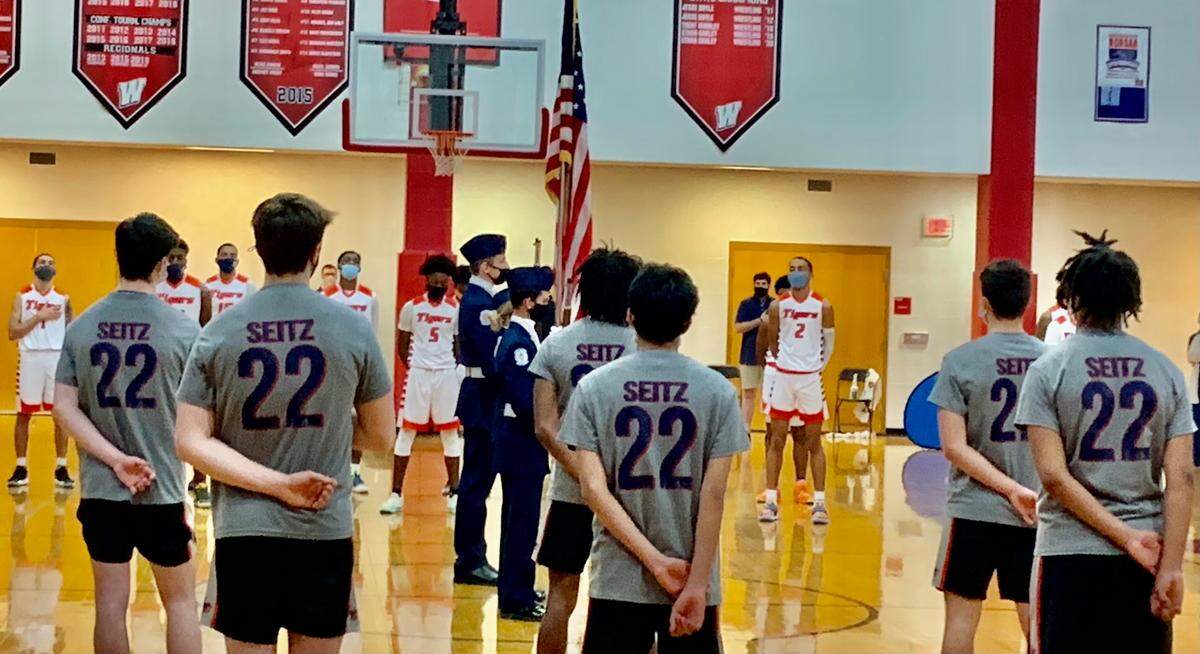 Lincoln Charter’s basketball players all wore “Seitz 22” shooting shirts before Saturday’s 1A men’s championship game between Lincoln Charter and Wilson Prep in Trinity, N.C. The shirts were in honor of Jamie Seitz, an assistant coach for the team who died from COVID on Dec. 27, 2020, and his son Carter Seitz, a senior for the team who also wears No. 22.