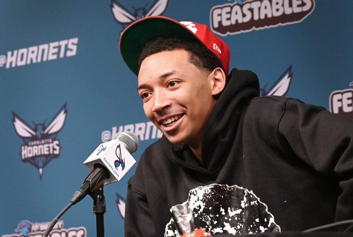 Charlotte Hornets guard Nick Smith smiles as he responds to a question about teammate Brandon Miller during an interview with the local media at Spectrum Center on Monday, April 15, 2024.