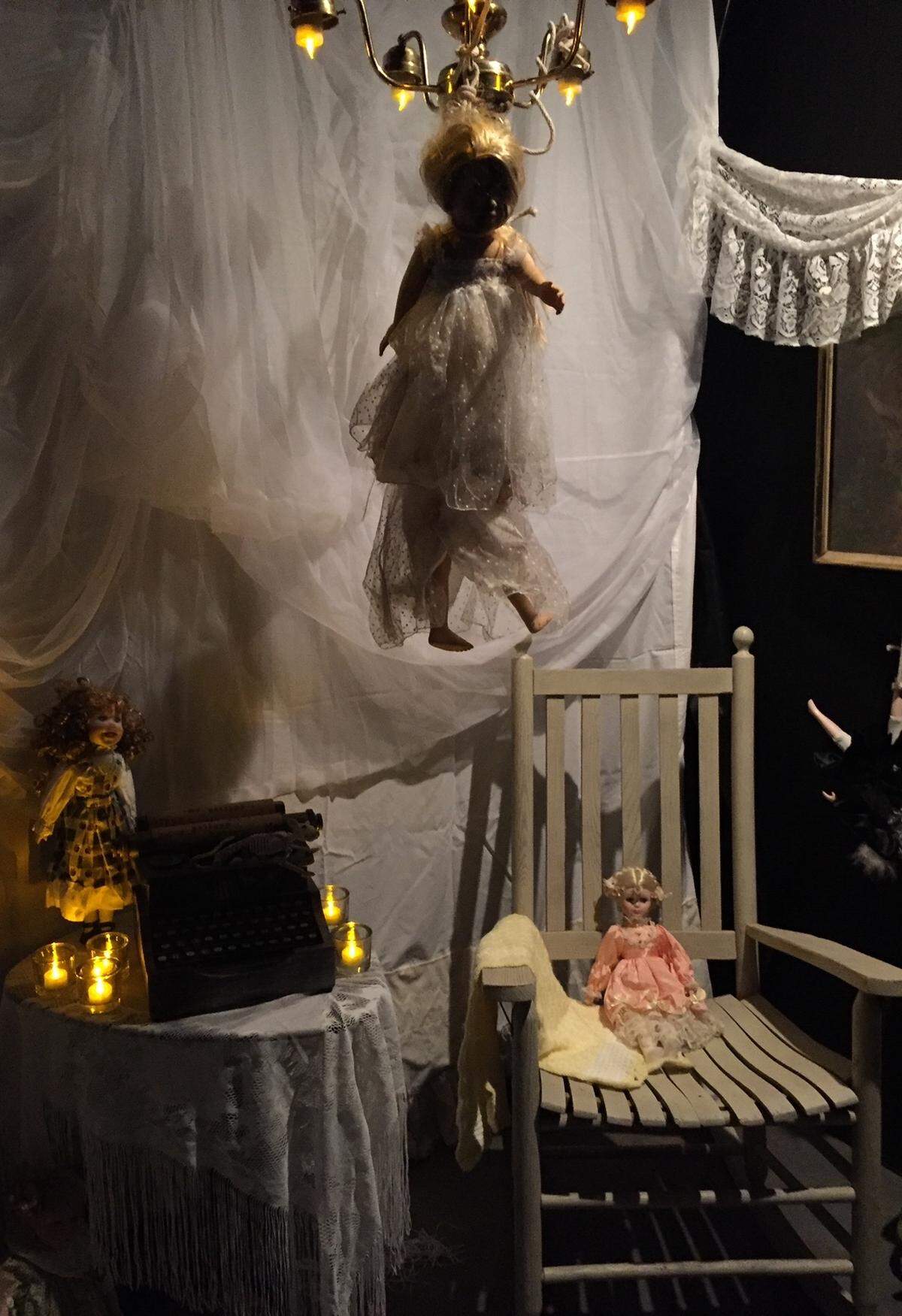 In 2016, the first year they built out the porch into vignettes, Kristen and Matthew created this creepy doll room.