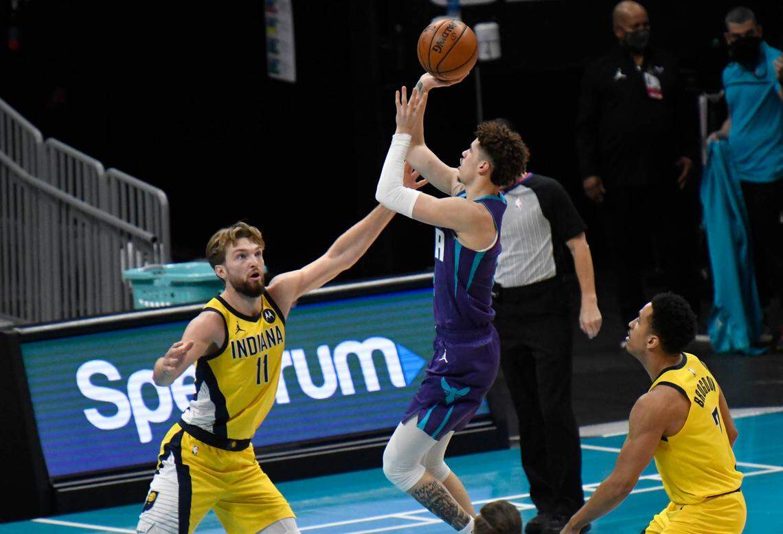 Charlotte Hornets guard LaMelo Ball (2) drives against Indiana Pacers forward Domantas Sabonis (11) Wednesday. Ball has played the first 18 games of his NBA career off the bench.