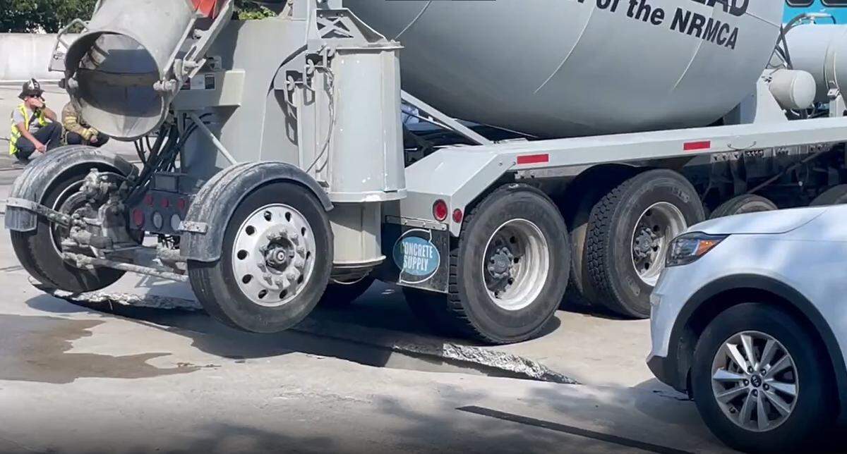 A large crack can be seen as a concrete mixer truck is removed from a parking deck in the 500 block of East Morehead Street in Charlotte, N.C., on Wednesday, Sept. 14, 2022.