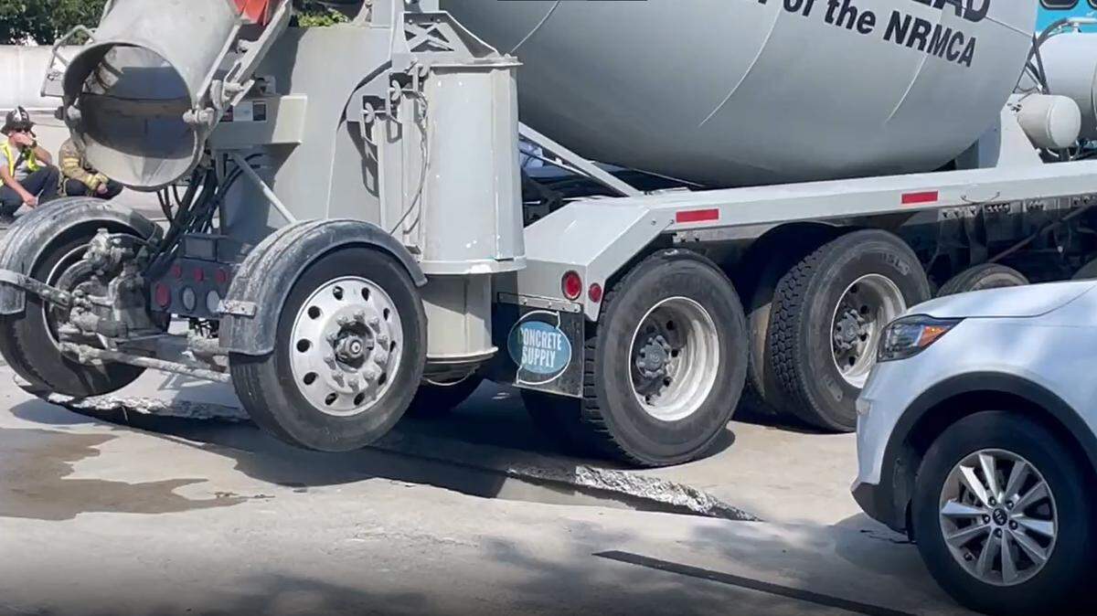 A large crack can be seen as a concrete mixer truck is removed from a parking deck in the 500 block of East Morehead Street in Charlotte, N.C., on Wednesday, Sept. 14, 2022.
