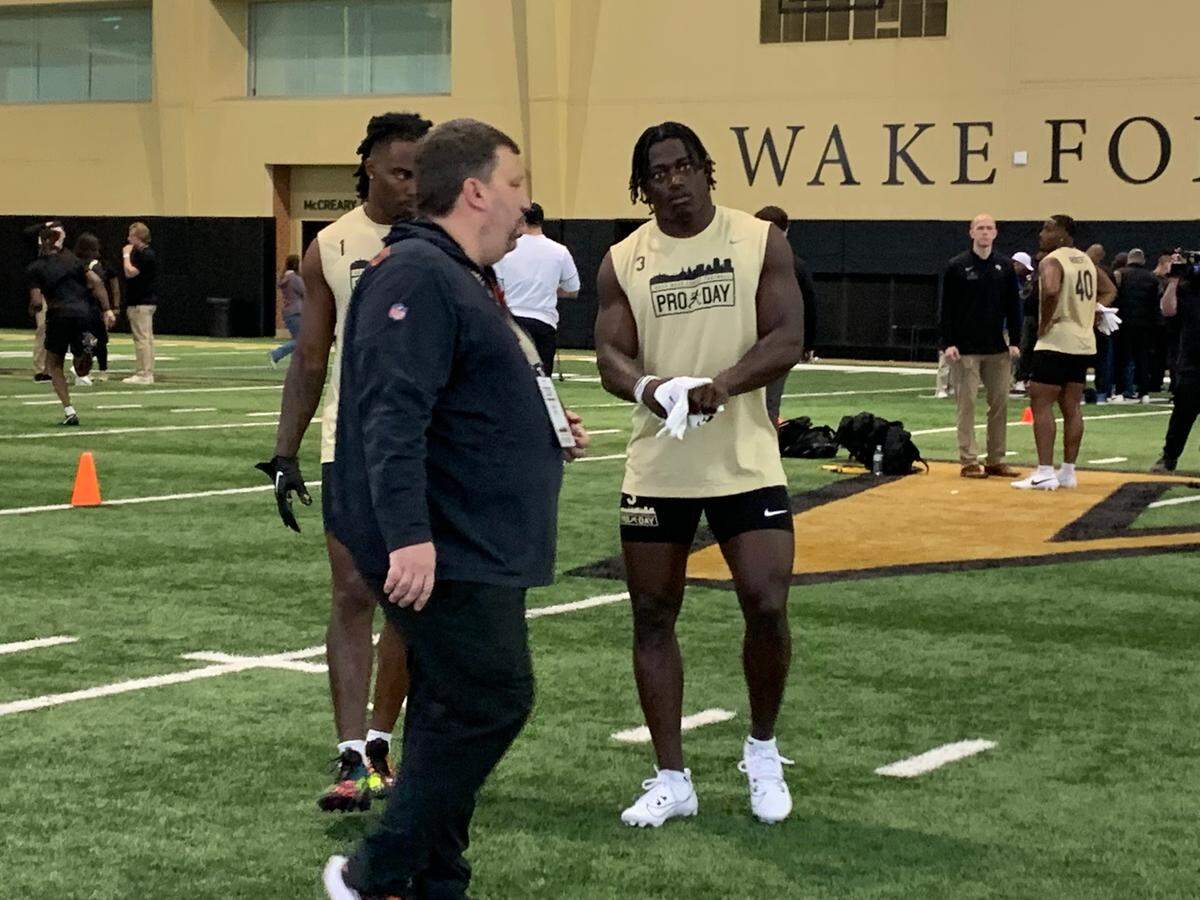 Wake Forest safety Malik Mustapha (right) takes part in field drills during the program’s pro day in the McCreary Football Field House on Wednesday, March 27, 2024.