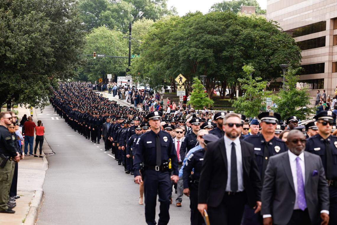 Law officers march during the processional of Charlotte-Mecklenburg Police Officer Eyer on Friday to First Baptist Church on Friday, May3, 2024. Officer Eyer was killed while serving a warrant in east Charlotte on Monday, April 29, 2024
