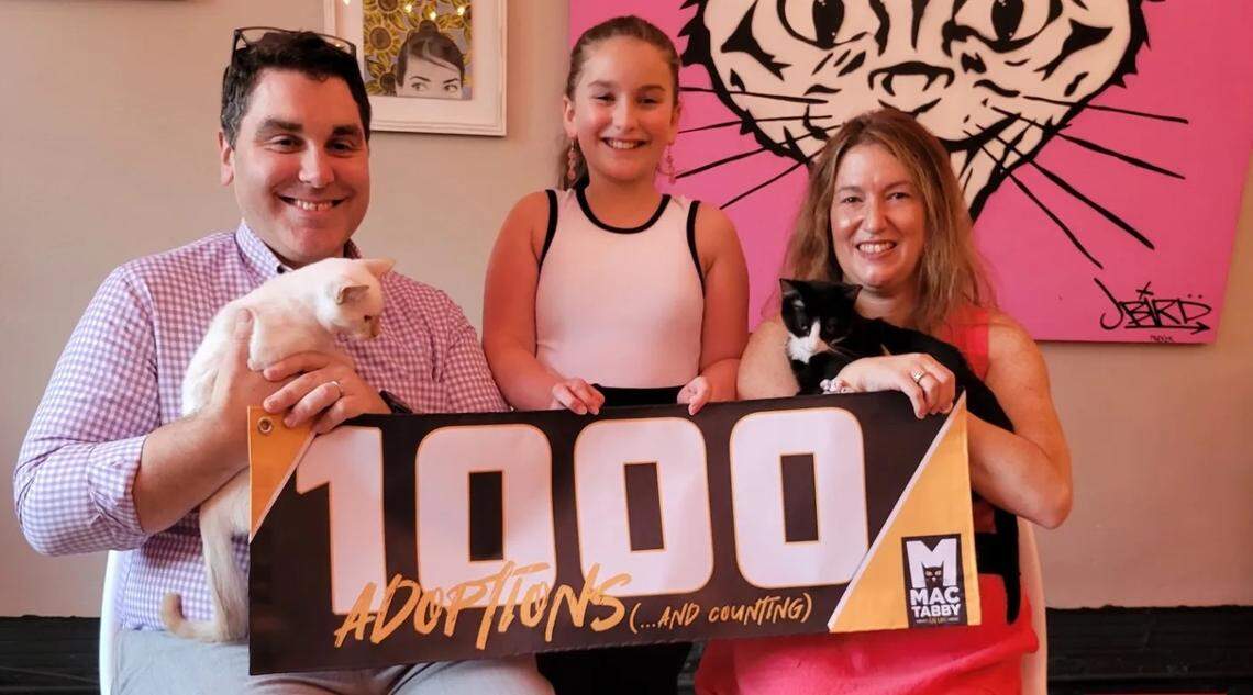 David and Kimberly Reisner, along with their daughter Lauren, adopted Leo and Reddi Whip from Mac Tabby Cat Café. 
