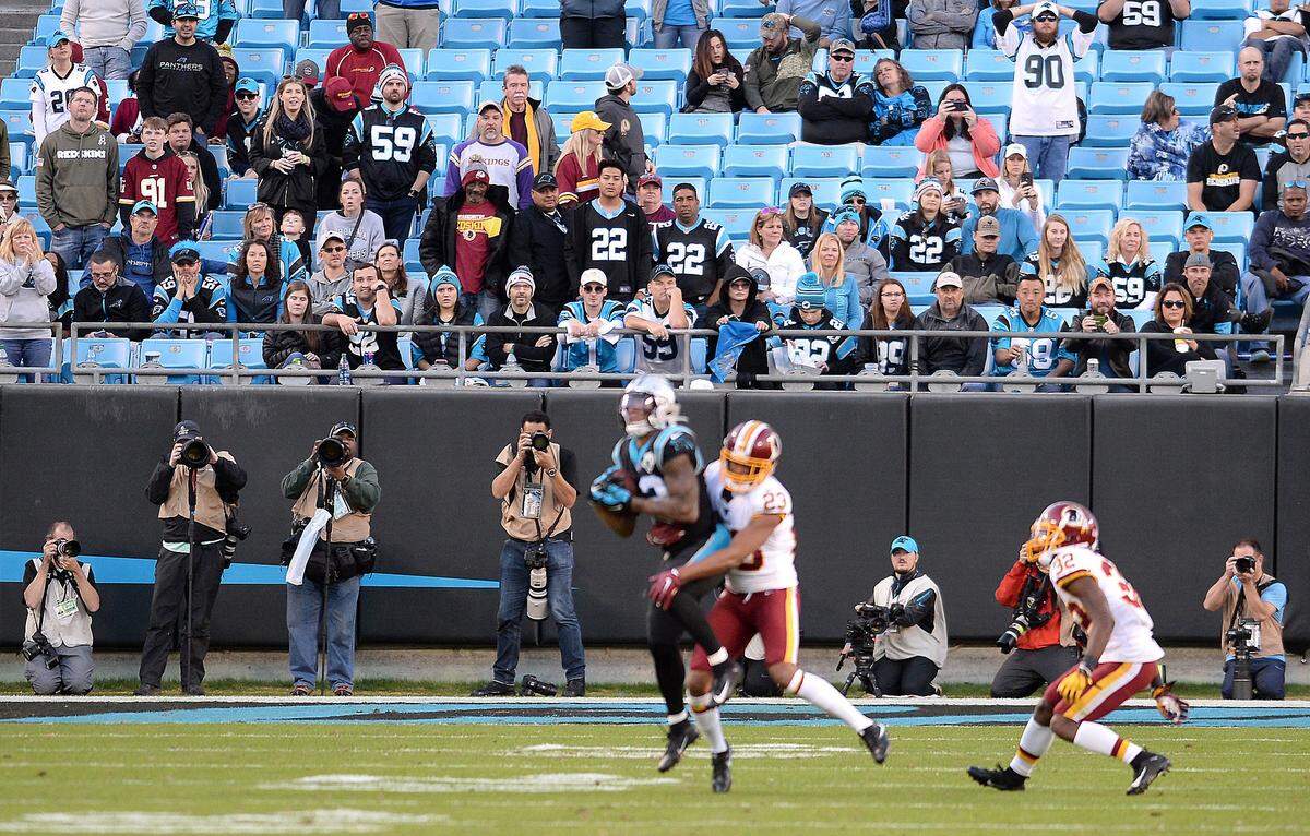 Empty seats are sprinkled in among the fans at the Carolina Panthers vs Washington football game.