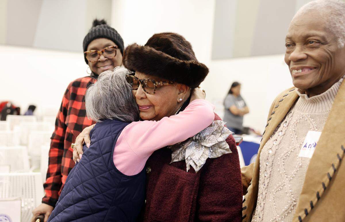 Vilma Leake, center, hugs a constituent Thursday, Feb. 5, 2026 at the Valerie C. Woodard Center in Charlotte.