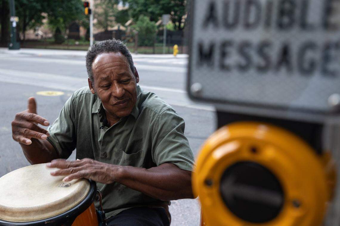 Joel Burks, 58, plays a conga drum on the corner of South Church and West Trade Streets Wednesday in uptown Charlotte. Burks says he been playing the drums since childhood. Now, it is part of how he makes his living.