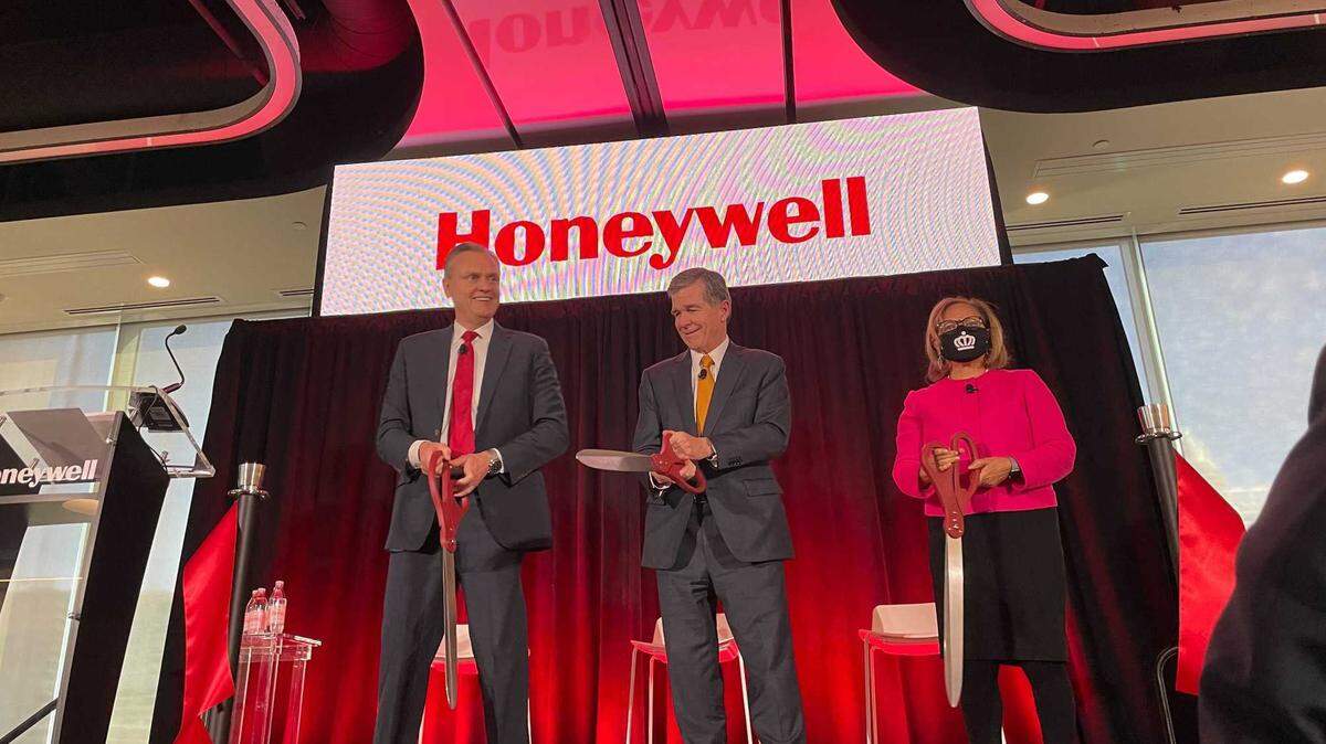 Honeywell CEO Darius Adamczyk, Gov. Roy Cooper and Mayor Vi Lyles at the grand opening of Honeywell’s uptown headquarters Wednesday. The company moved to Charlotte from New Jersey in 2019.