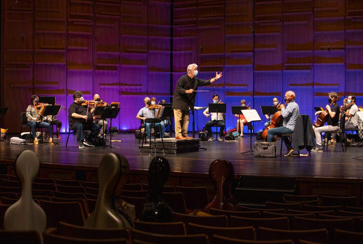 To comply with COVID-19 guidelines during rehearsal the Charlotte Symphony Orchestra was pared down to allow social distancing between musicians.