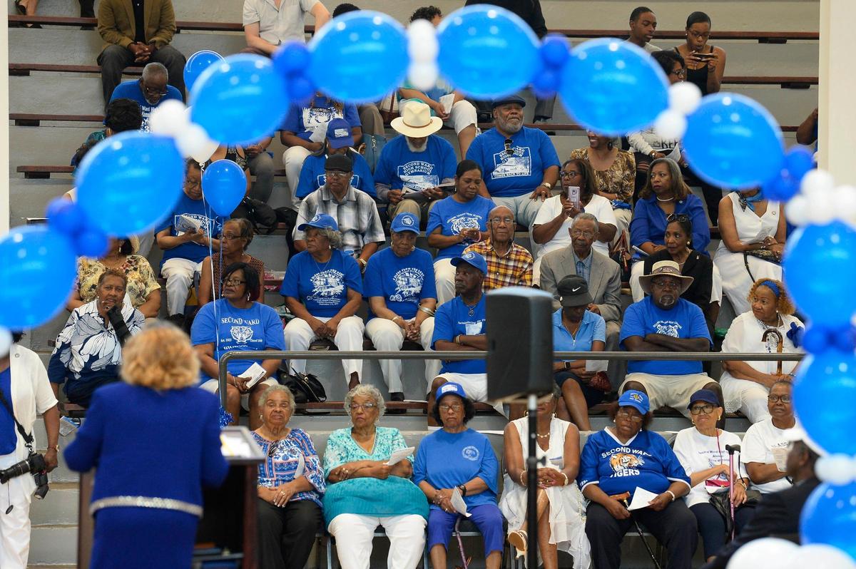 Second Ward High School alumni listen to NC Senator Joyce Davis Waddell, District 40, lower left, during the 50th anniversary of the closing of the school at the Second Ward High School Gymnasium and Museum on Saturday, June 1, 2019. After the school closed its doors in 1969, it was bulldozed as part of urban renewal and the destruction of the Brooklyn neighborhood.