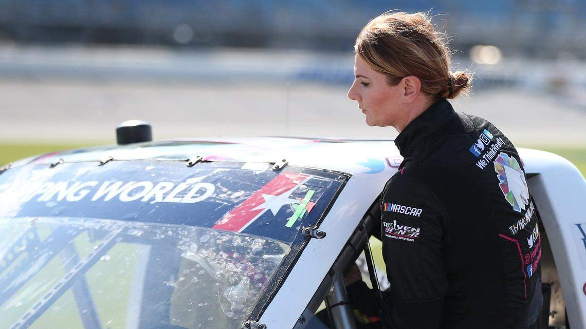 Driver Jennifer Jo Cobb gets into her truck during qualifying for the NASCAR Truck Series race at Chicagoland Speedway in 2018. NASCAR decided that Cobb, 47, is not qualified to drive in the Cup Series race at Talladega this weekend.