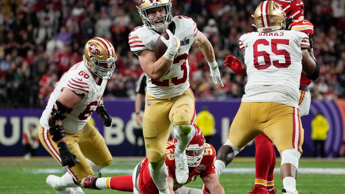 San Francisco 49ers running back Christian McCaffrey (23) runs into the end zone for a topuchdown against the Kansas City Chiefs during the first half of the NFL Super Bowl 58 football game Sunday, Feb. 11, 2024, in Las Vegas.
