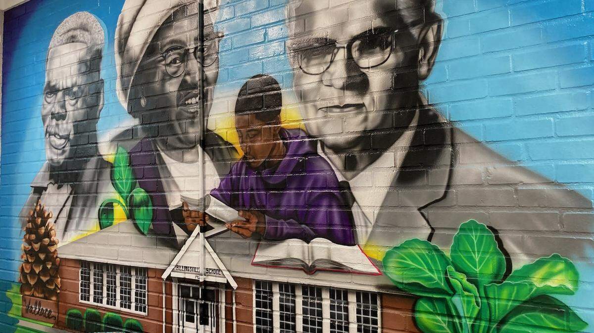 A mural on the wall of the Grier Heights Community Center features Sam Billings, Naomi Drenan and Arthur S. Grier. The center is the site of a new exhibit telling the comunity’s story by the Levine Museum of the New South.