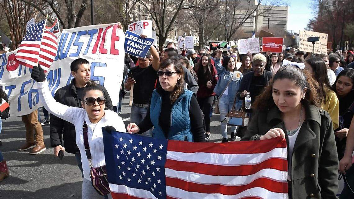 Immigrants and supporters march from Marshall Park in Charlotte, NC on Monday, February 18, 2019, to protest arrests by ICE. ICE posted billboards along Charlotte interstates with photos of wanted men, the agency said on Friday, Nov. 6, 2020.