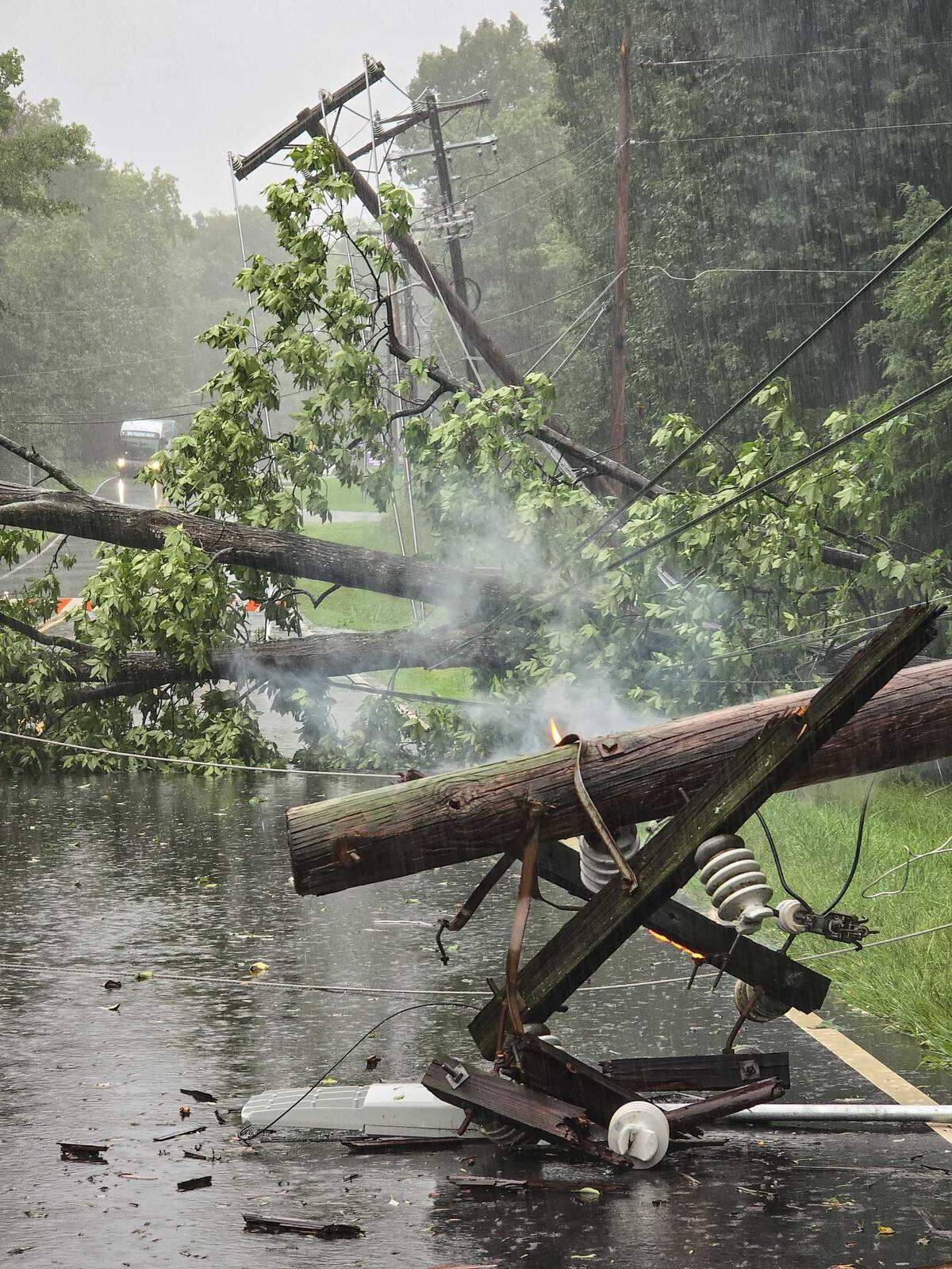 A power line fell on Freedom Drive near Charlotte’s Woodford Green neighborhood as Tropical Storm Debby drenched the region on Thursday, Aug. 8, 2024.
