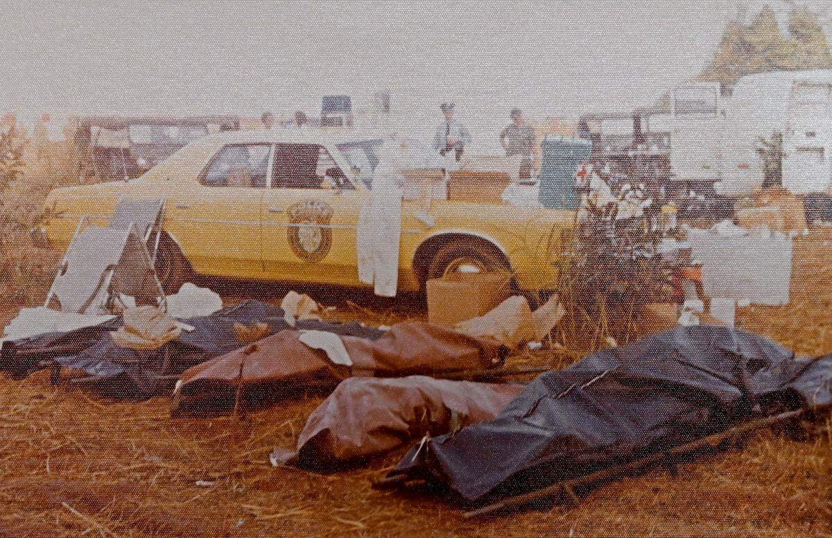 Body bags are lined up near the site of the Eastern Air Lines Flight 212 crash of Sept. 11, 1974.