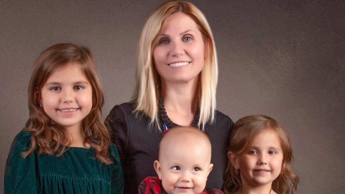Maria Prosvelov and her kids posed for this Christmas card photo last week. This is the first Christmas they’ll spend without their husband and father, Andre, who died of a stroke in July.