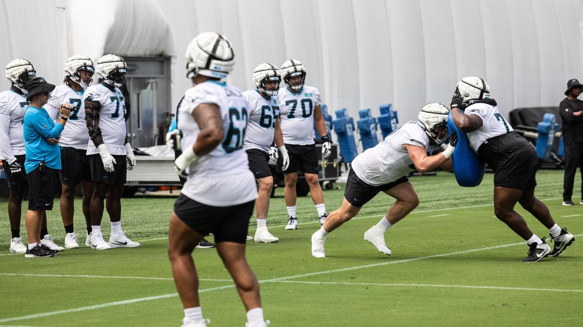 The Carolina Panthers offensive line runs drills during practice in Charlotte, N.C., on Monday, August 14, 2023.