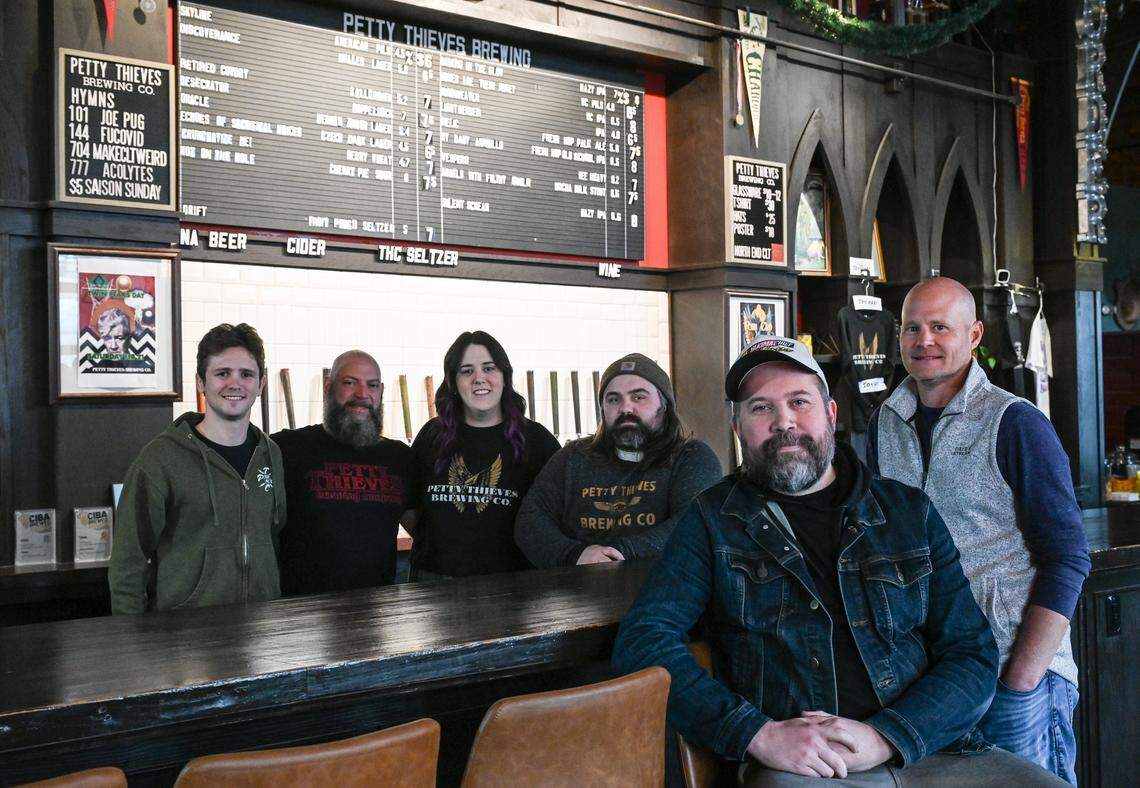 Brian Kletch, far right, poses with the staff of Petty Thieves Brewing Co., who will stay on after Kletch assumes ownership this Sunday, March 1, 2026. Kletch plans to keep the brewery as it is with minimal updates to give it his own personal touch.