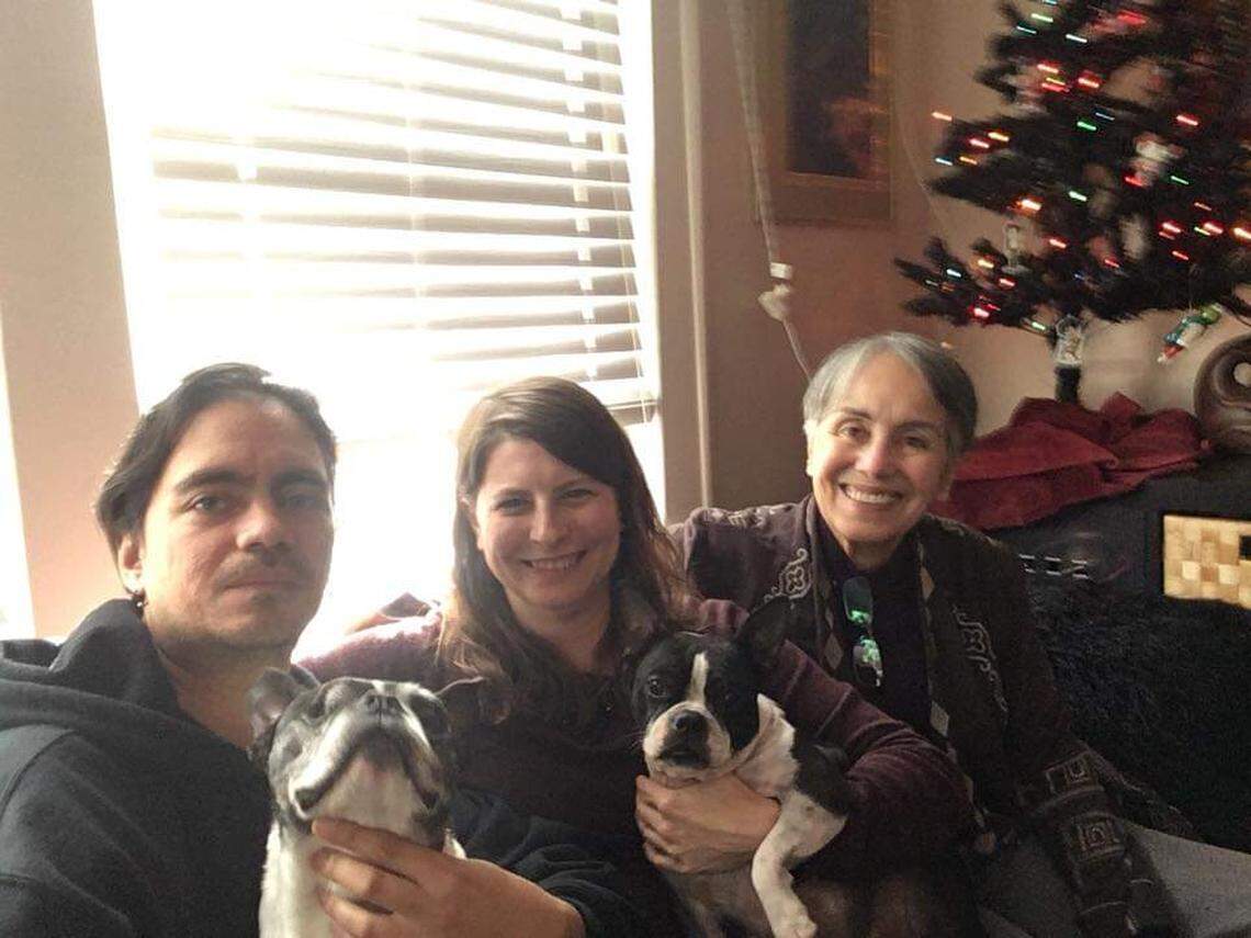 Nicole Peterson (center) will celebrate Thanksgiving in Charlotte with just her husband Eric and his mother, who lives in the house next door.