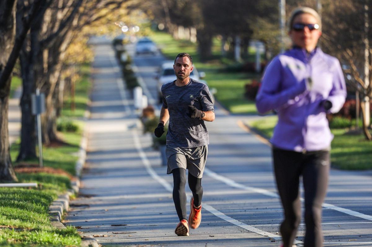 Frank Turner runs down The Plaza with a run group on Saturday, March 26, 2022 in Charlotte, NC.