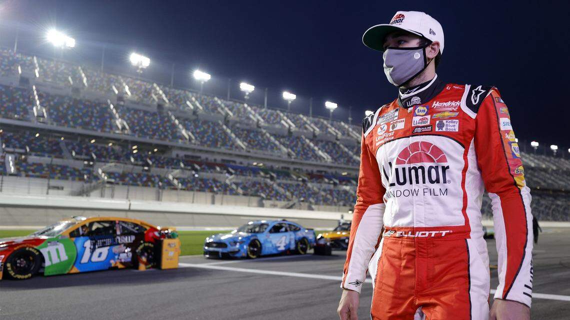 DAYTONA BEACH, FLORIDA - FEBRUARY 09: Chase Elliott, driver of the #9 Llumar Chevrolet, walks the grid p0rior to the NASCAR Cup Series Busch Clash at Daytona at Daytona International Speedway on February 09, 2021 in Daytona Beach, Florida. (Photo by Jared C. Tilton/Getty Images)