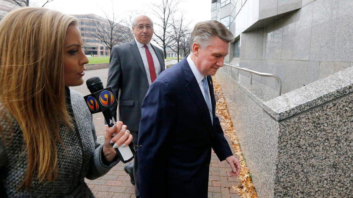 Republican Mark Harris and his attorney David Freedman, left center, walk to the Dobbs Building in Raleigh, N.C., Thursday, Jan. 3, 2019. Harris was in Raleigh to be interviewed by the NC Board of Elections in regards to a political scandal in the 9th District.