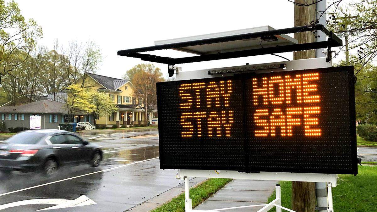 A mobile sign alerts drivers on John Street in Matthews to “Stay Home, Stay Safe.” Mecklenburg County residents have been ordered to stay at home for at least the next three weeks to help slow the spread of coronavirus and prevent a surge of COVID-19 cases from overwhelming local hospitals.