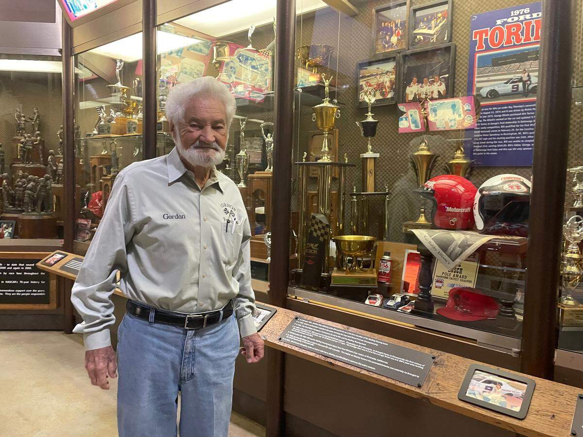 Gordon Pirkle, a director at the Georgia Racing Hall of Fame, owns the Dawsonville Pool Room restaurant. He poses with Bill Elliott’s trophies at the nearby Hall of Fame.