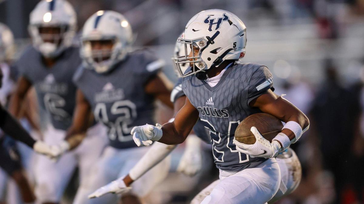 Hickory Ridge’s Donovan Stone returns a Butler kick in the first half at Hickory Ridge high school on Friday, March 26, 2021.