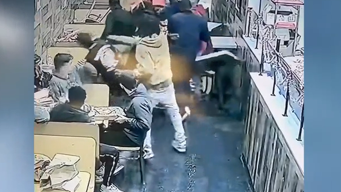 A pizzeria owner in downtown Winston-Salem was beaten and kicked unconscious after trying to break up a late-night fight, surveillance video shows.