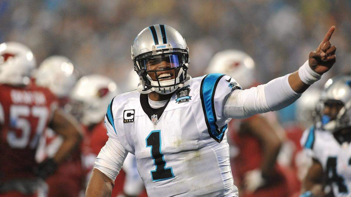 Carolina Panthers quarterback Cam Newton (1) celebrates a touchdown run by running back Fozzy Whittaker vs the Arizona Cardinals during third quarter action on Saturday, January 3, 2015 in Charlotte, NC. The Panthers defeated the Cardinals 27-16 in NFL Wild Card action.