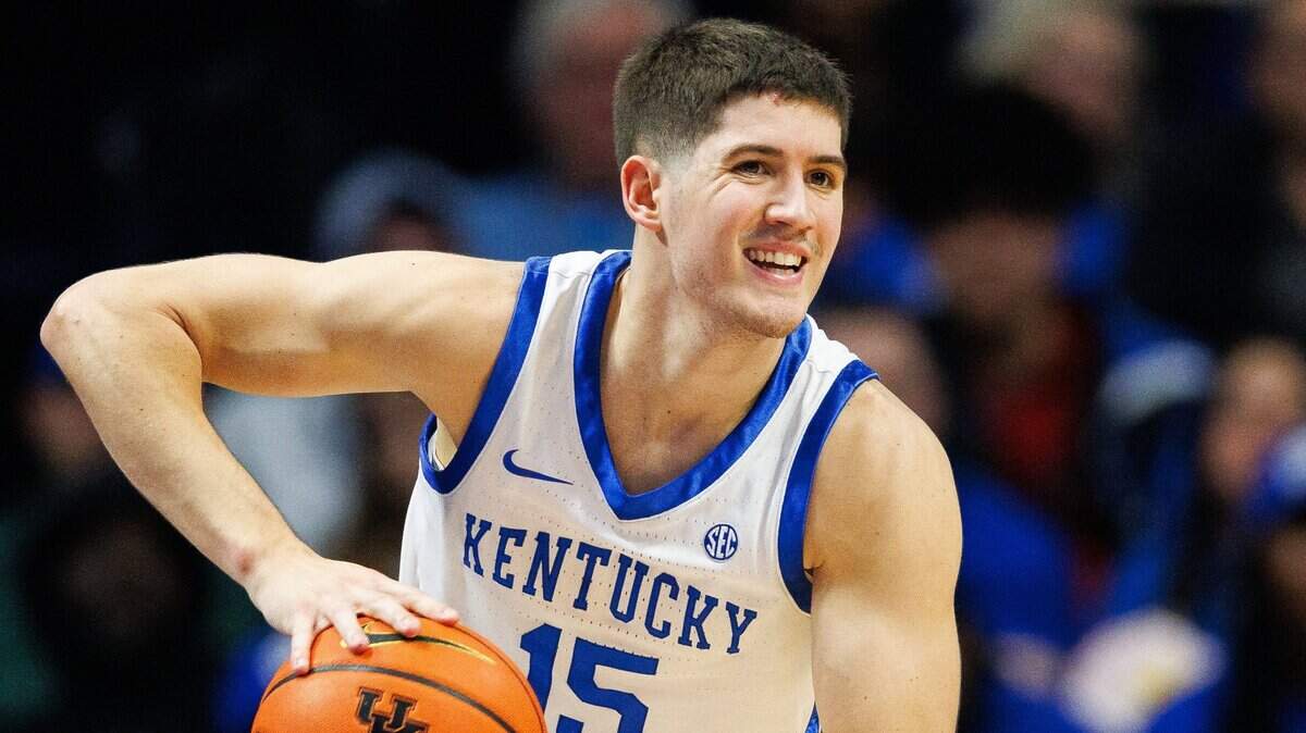 Kentucky Wildcats guard Reed Sheppard (15) passes the ball during the first half against the Arkansas Razorbacks at Rupp Arena at Central Bank Center.