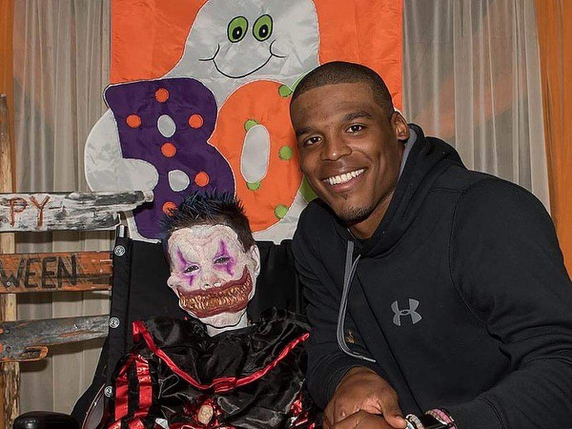 Cam Newton with 10-year-old Elijah Aschbrenner of Concord in September 2015.