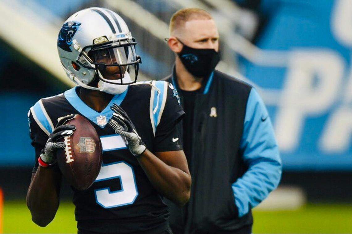 Teddy Bridgewater warms up as offensive coordinator Joe Brady watches ahead of their game against Tampa Bay Buccaneers at Bank of America Stadium in Charlotte, NC on Sunday, November 15, 2020.