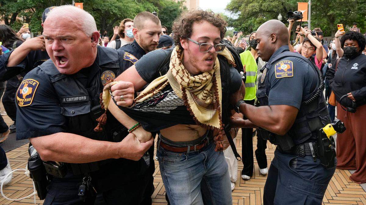 University of Texas police officers arrest UT student Ammer Qaddumi at a pro-Palestinian protest at UT Wednesday, April 24, 2024 in Austin, Texas.