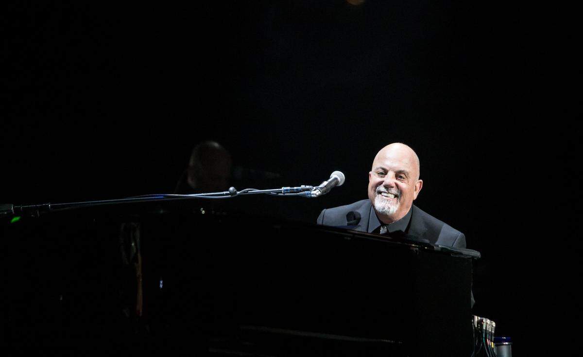Billy Joel smiles at the crowd while performing at the former Time Warner Cable Arena in Charlotte in December 2015.