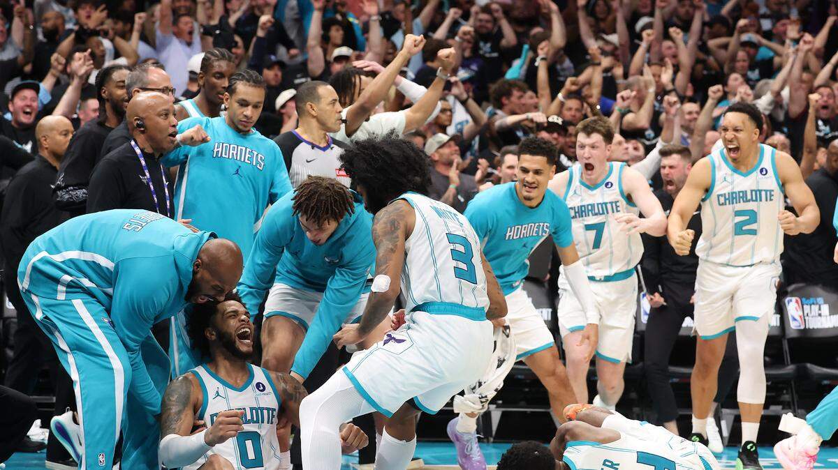 The Charlotte Hornets celebrate the team’s win over the Miami Heat at Spectrum Center in Charlotte, NC on Tuesday, April 14, 2026. The Hornets defeated the Heat 127-126 in NBA Play-in-Tournament basketball game. Guard LaMelo Ball hit the game winning shot on a layup in the closing seconds.