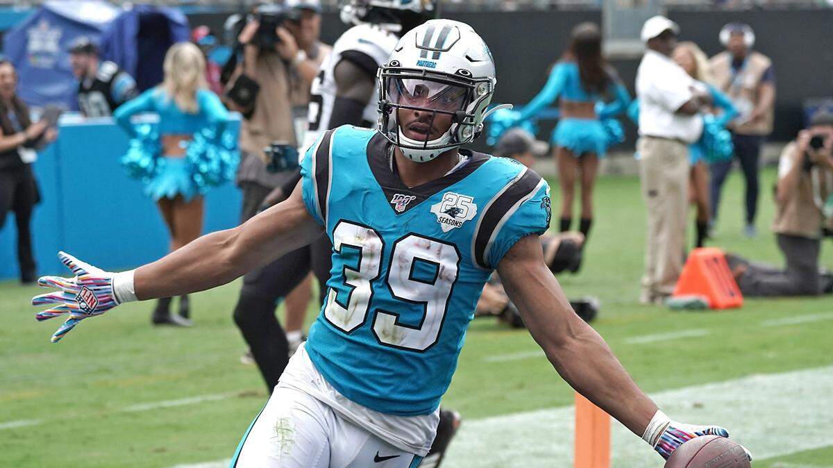 Panthers running back Reggie Bonnafon celebrates his touchdown run against the Jacksonville Jaguars.
